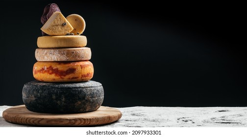 variation of hard and semi-hard cheese on dark background. Petit Basque, French cheese, spanish manchego cheese. - Shutterstock ID 2097933301