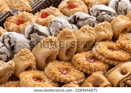 Variation of traditional fresh baked Moroccan cookies full frame close up as background
