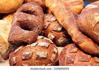 Varied Bread Loaves On A Bakery Shop Counter. Selective Focus.