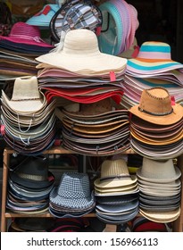Varied fashion hats showcase on open market shop 
