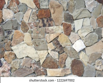 
The varied texture of natural stone is used in wall cladding. Background.					