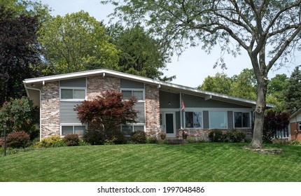 Variegated Brick House With Slanted Roof