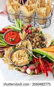 Varieties of Dips with Assorted Raw Vegetables for Dipping. Healthy vegetarian vegan grazing board