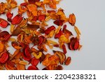 Varieties of Dried Flowers Orange and Red Colors for Potpourri, Fall Colors with a White Background