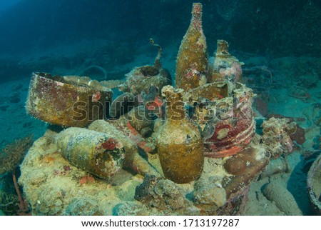 A variety of artifacts that can be discovered by scuba divers in a sunken ship. The vessel that held this cargo was a second world war Japanese ship that was sunk in Chuuk Lagoon during conflict