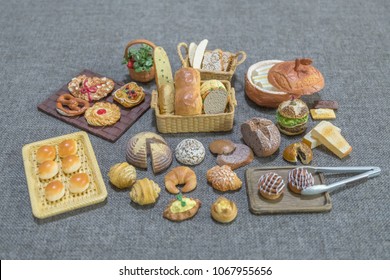 Variety and Assortments of miniature toys bakery and cake on gray background. - Shutterstock ID 1067955656