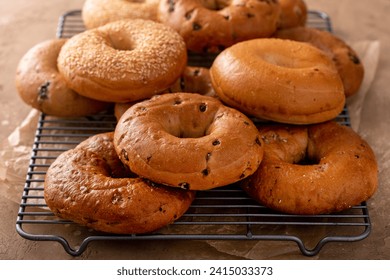 Variety of bagels freshly baked for breakfast with plain, sesame and cinnamon raisin - Powered by Shutterstock