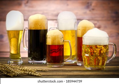 Variety Of Beer Glasses On A Wooden Table