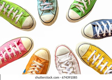 Variety Of The Bright And Colorful Leather Shoes On White Background.  Sneaker Shoes, Gym Shoes Standing In Circle On White Background, Top View,