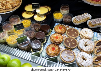 variety of cakes and pastry bakery showing in a storage freezer - Shutterstock ID 1348489679