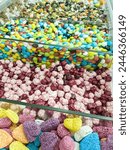 A variety of candy in a display case. Jelly sugar candies. Colorful Sweets on a market, candy shop.
