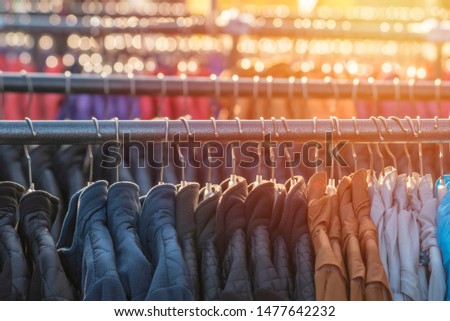 a variety of clothes offered for sale by street vendors