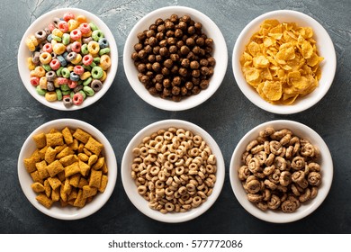 Variety Of Cold Cereals In White Bowls, Quick Breakfast For Kids Overhead Shot