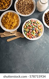 Variety Of Cold Cereals In White Bowls, Quick Breakfast For Kids Overhead Shot With Copyspace