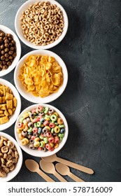 Variety Of Cold Cereals In White Bowls, Quick Breakfast For Kids Overhead Shot With Copyspace