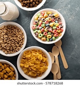 Variety Of Cold Cereals In White Bowls, Quick Breakfast For Kids Overhead Shot With Copyspace