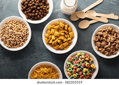 Variety Of Cold Cereals In White Bowls, Quick Breakfast For Kids Overhead Shot.