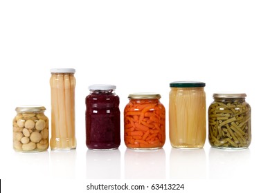 Variety Of Colorful Canned Vegetables In Glass Pot. Food, Preserve Concept. Studio Shot. White Background. Copy Space.