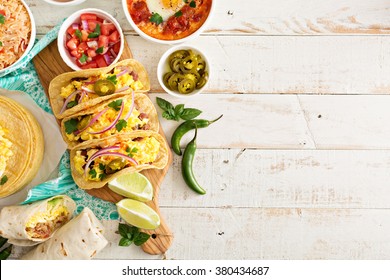 Variety of colorful mexican cuisine breakfast dishes on a table