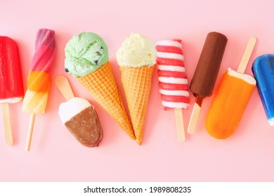 Variety of colorful summer popsicles and ice cream treats. Overhead view scattered on a pink background. - Powered by Shutterstock