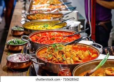 Variety of cooked curries on display at Camden Market in London