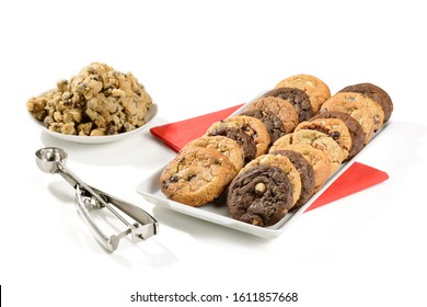 A Variety Of Cookies On A White Plate, With Raw Cookie Dough Aside. Isolated On White Background.