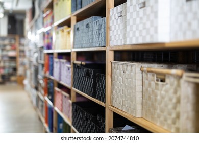 Variety Of Decorative Storage Boxes Displayed On Shelving In Household Goods Store. Concept Of Goods To Organize Home Space