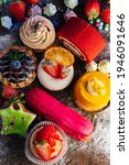 Variety of delicious confectionery products. A mix of chocolate mousse, eclair cakes, Cupcakes and Shu cakes for a candy bar, or a pastry shop showcase presentation. 