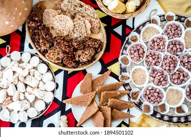 Variety of delicious dessert from Angola on a table covered with  African fabric