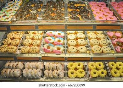 Variety of delicious donut on display at bakery cake shop.