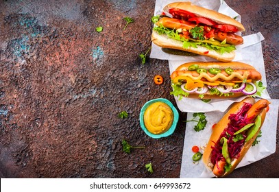 Variety Of Delicious Hot Dogs With Vegetables And Sauces On A Vintage Serving Tray. View From Above.