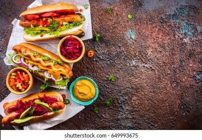 Variety Of Delicious Hot Dogs With Vegetables And Sauces On A Vintage Serving Tray. View From Above.