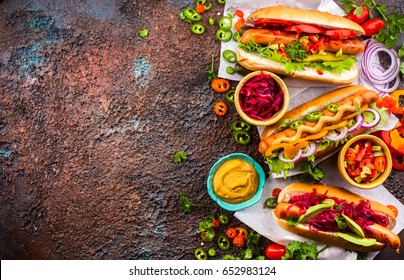 Variety Of Delicious Hot Dogs With Vegetables And Sauces On A Vintage Serving Tray. View From Above.