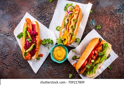 Variety Of Delicious Hot Dogs With Vegetables And Sauces On A Vintage Serving Tray. View From Above.