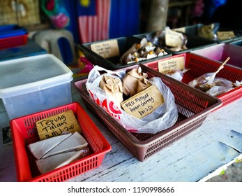 Variety Of Delicious Malaysian Breakfast Sold At Street Market Stall In Kuala Trengganu In A Pre Packed Items Clusters In Containers.