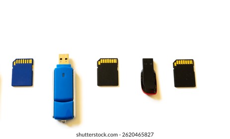 Variety of different USB flash memory drives ad SD cards on perfect white background.
