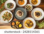 Variety of exquisite dishes to share in a hotel restaurant. Starters, salads and main courses. Tasty food and different options.