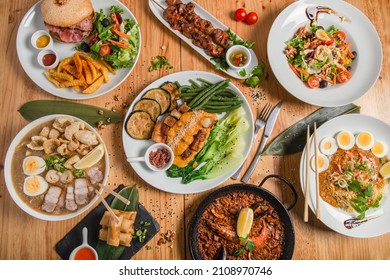 Variety of Filipino food dishes - Shutterstock ID 2108970746