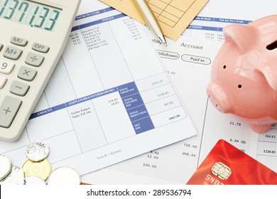 Variety Of Financial Objects Arranged On Wage Slip