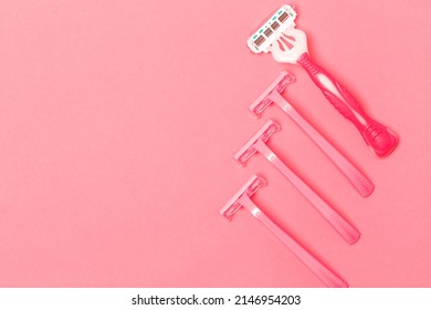 Variety of Four Female Pink Disposable Razors Shavers Placed Together Over Trendy Pink Coral Background. Horizontal image - Shutterstock ID 2146954203