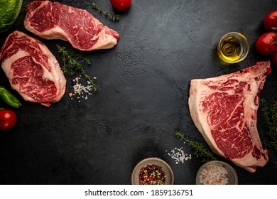 Variety of Fresh Raw Black Angus Prime Meat Steaks T-bone, New York, Ribeye and seasoning on black background, top view - Shutterstock ID 1859136751