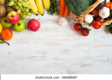 Variety of fruits and vegetables, on the white wooden table, top view, copy space, selective focus