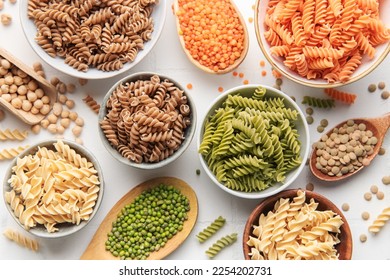 A variety of fusilli pasta made from different types of legumes, green and red lentils, mung beans and chickpeas. Gluten-free pasta.