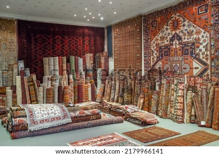 Variety of the gorgeous oriental carpets in traditional carpet store in Middle East. Pile of beautiful handmade carpets on the traditional Middle East market bazaar.  Photo stock © 
