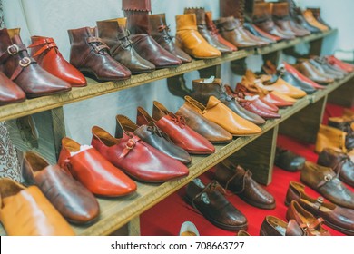 Variety of handmade medieval leather shoes on the display.  - Powered by Shutterstock