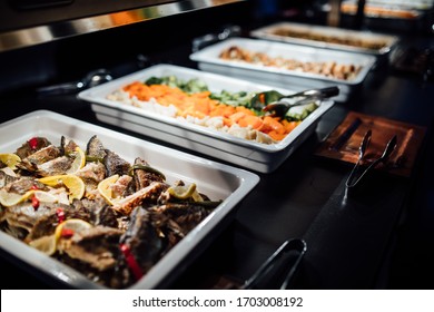 Variety of healthy dishes decorated and served for a special occasion celebration buffet dinner.Mediterranean ketogenic diet.Grilled fish and vegetables.Healthy wedding dinner restaurant buffet menu