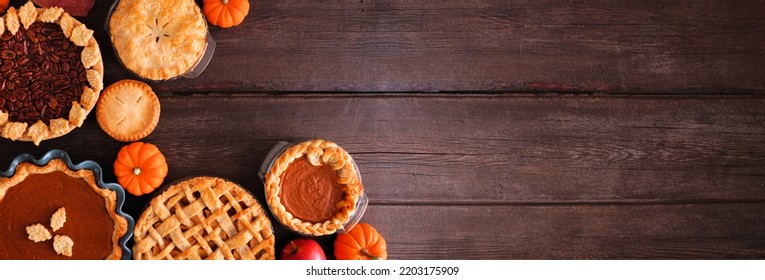 Variety Of Homemade Fall Pies. Pumpkin, Apple And Pecan. Top View Corner Border On A Dark Wood Banner Background With Copy Space.