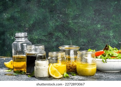 Variety of homemade salad dressings. Set of various salad sauces, oil, vinaigrette, mustard, mayonnaise, ranch, balsamic, soy, yogurt dressings - Shutterstock ID 2272893067