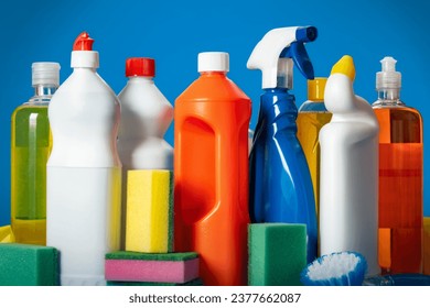 Variety house cleaning product on a blue background  - Powered by Shutterstock