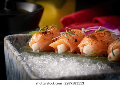 Variety of Japanese dishes made with fresh fish and fresh ingredients beautifully decorated, The lighting highlights the vibrant colors and textures of the Japanese cuisine.   - Powered by Shutterstock